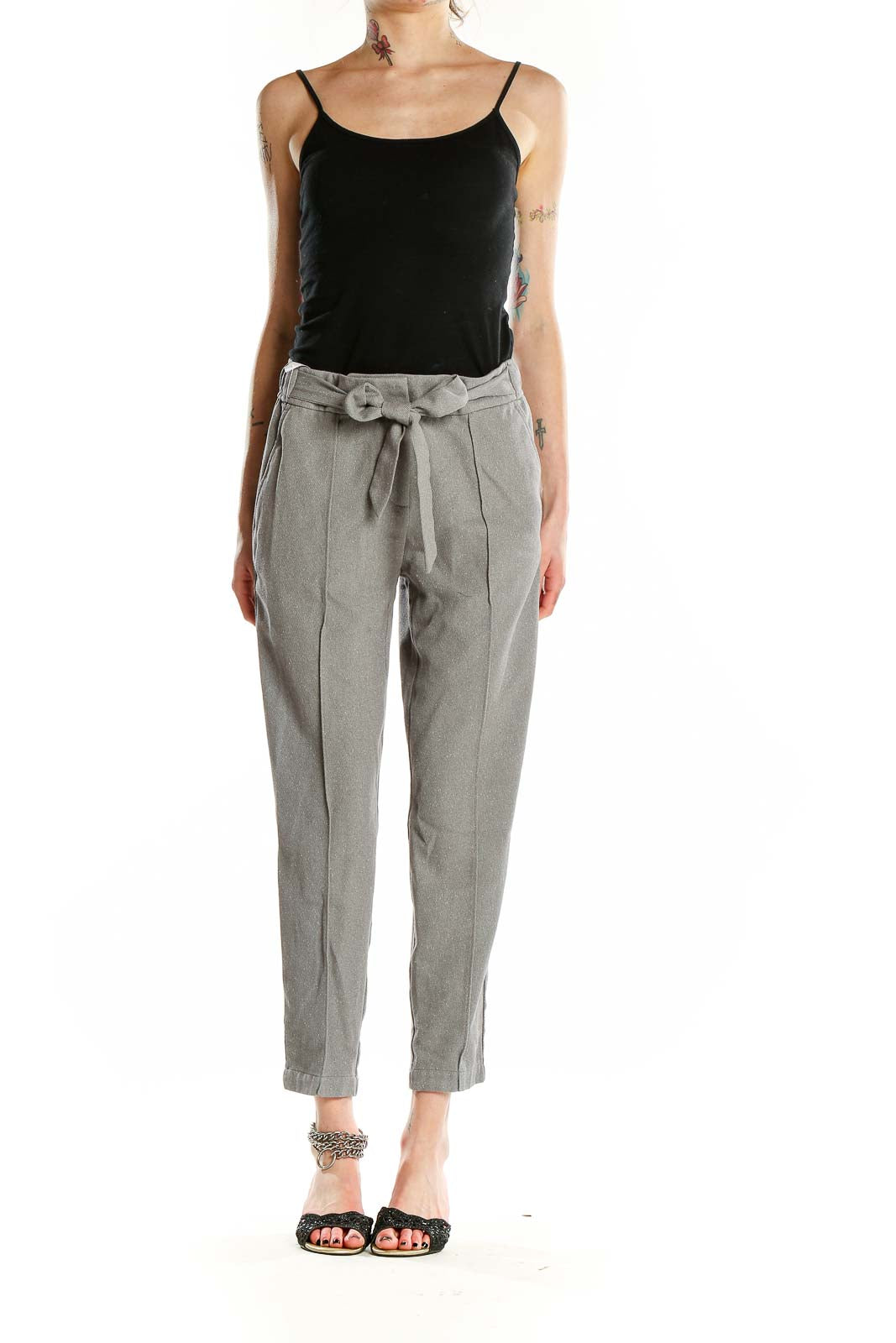 Front view of gray ankle-length trousers with paper bag waist and self-tie belt