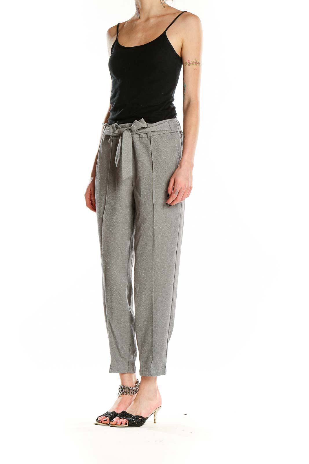 Front view of gray ankle-length trousers with paper bag waist and self-tie belt