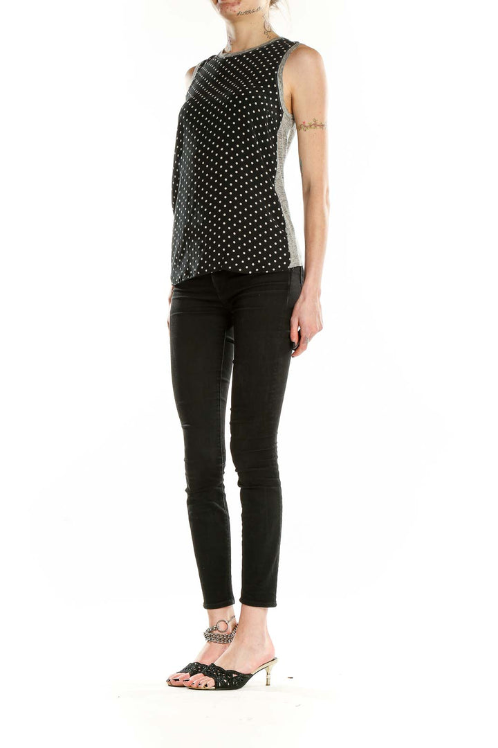 Front view of J.Crew black polka dot sleeveless blouse with gray trim