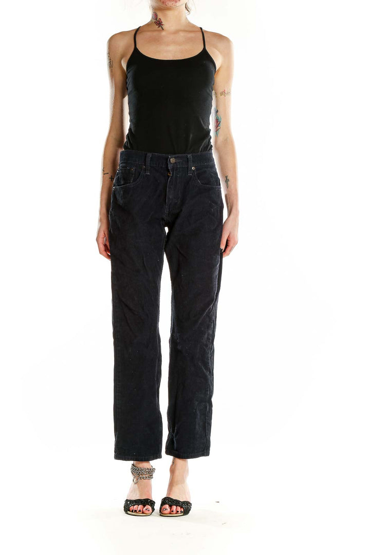 Front view of Levi's black corduroy straight leg pants on model