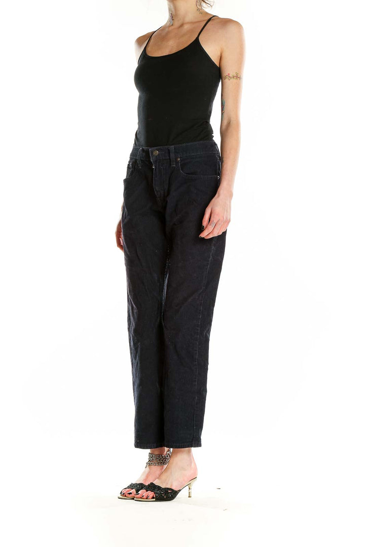 Front view of Levi's black corduroy straight leg pants on model