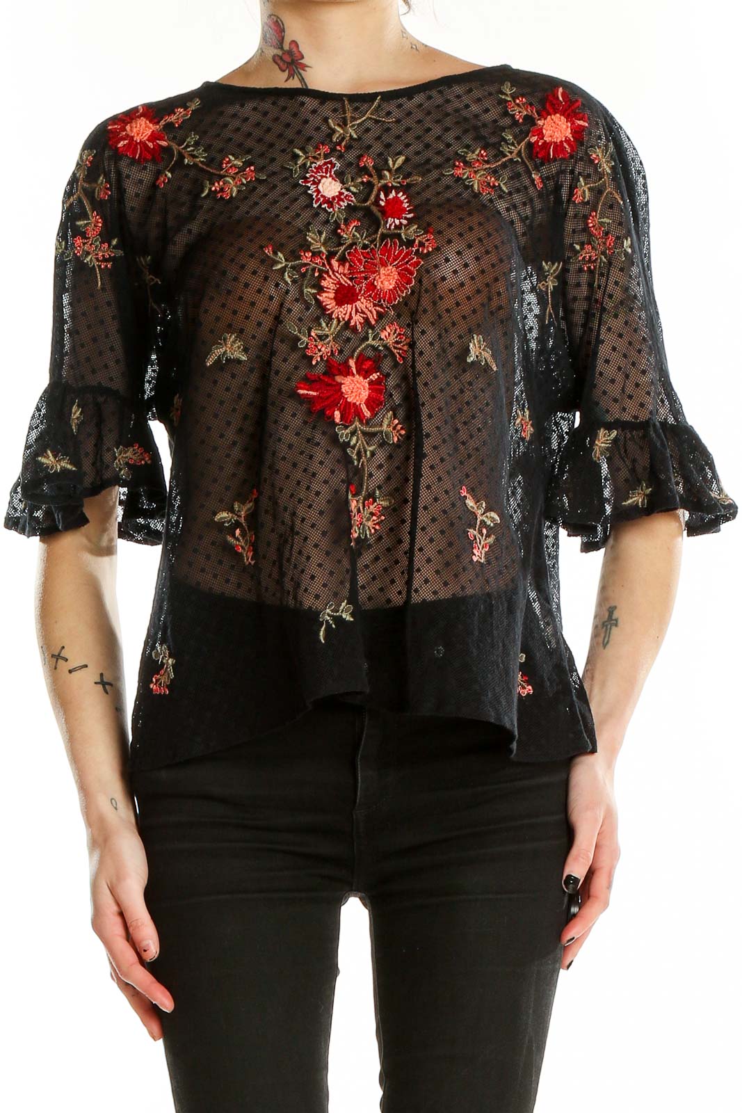 Front view of Maeve black sheer blouse with red floral embroidery and bell sleeves