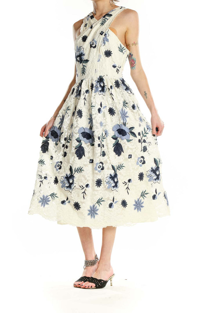 Front view of Tahari Arthur S. Levine ivory lace midi dress with blue floral pattern