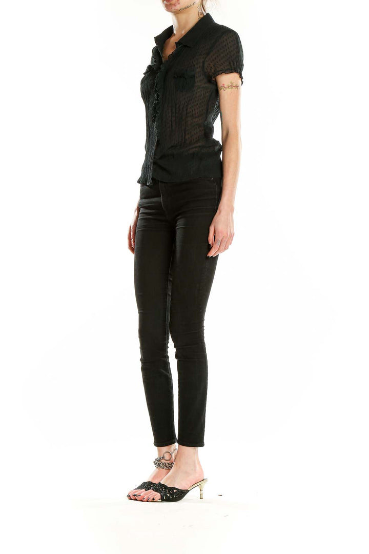 Front view of Bebe black sheer silk button-up blouse