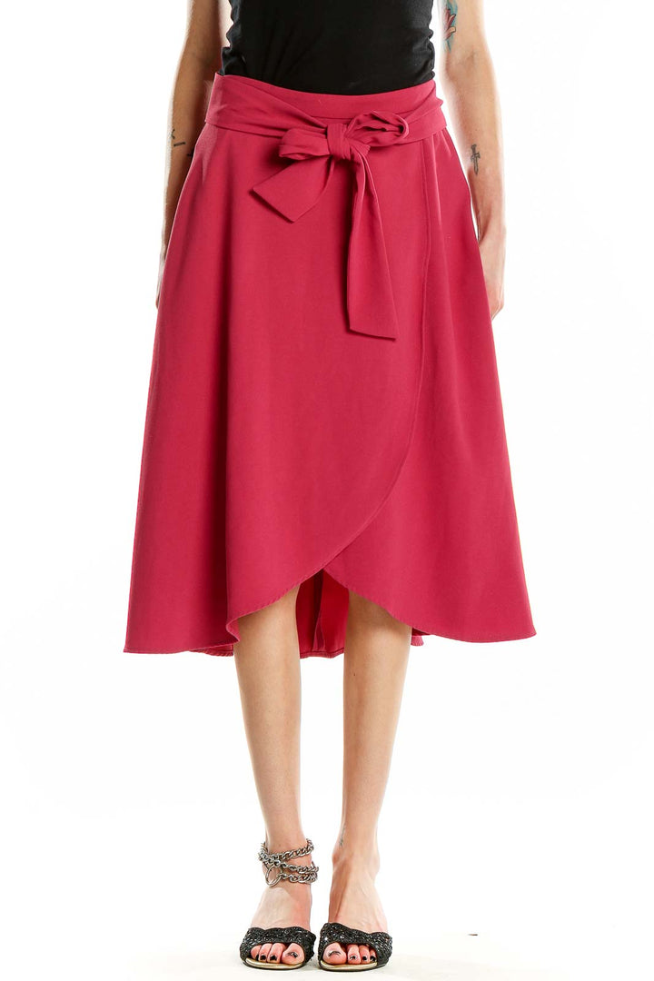 Front view of Ann Taylor pink wrap-style midi skirt with tie waist