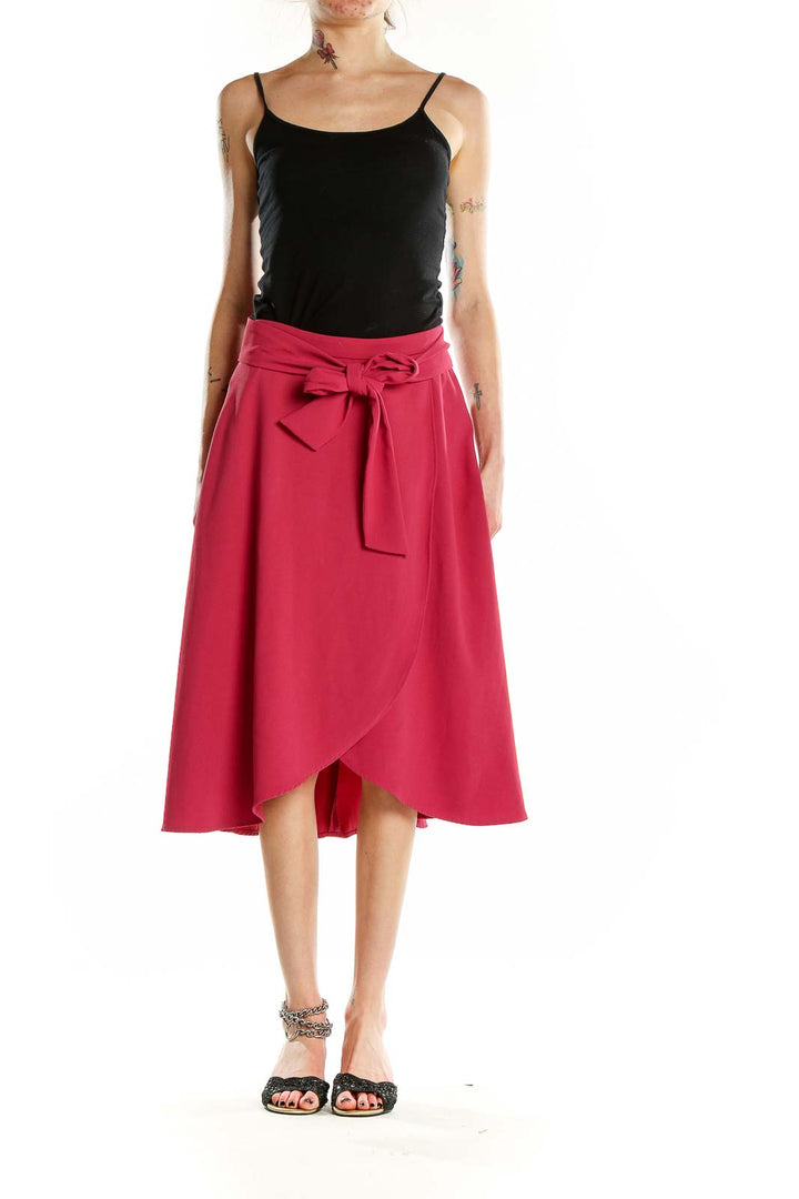 Front view of Ann Taylor pink wrap-style midi skirt with tie waist