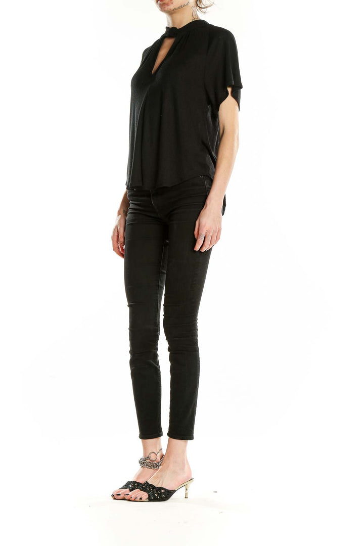 Front view of RACHEL Rachel Roy black blouse with keyhole neckline