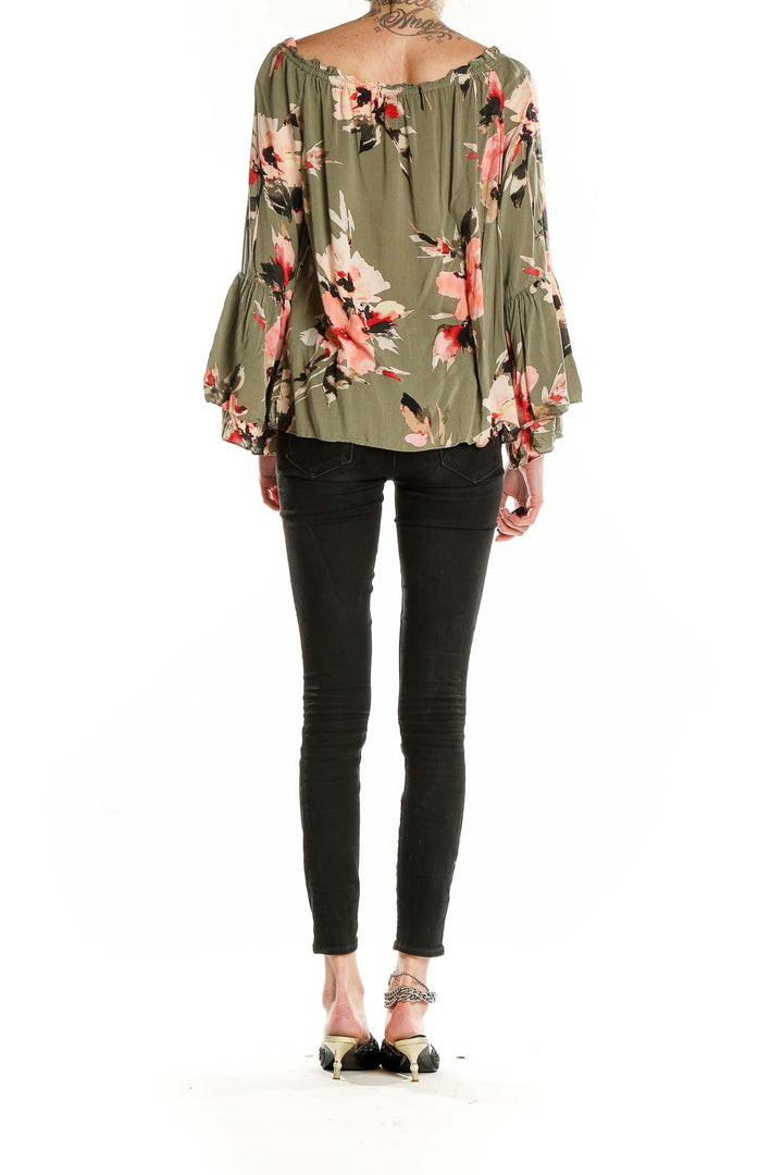 Back view of olive green floral blouse showing full length and fit