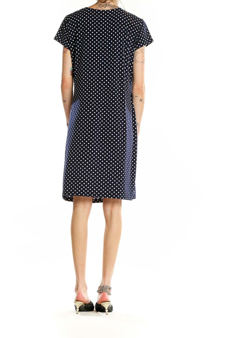 Back view of Jones New York black polka dot wrap dress showing knee-length cut