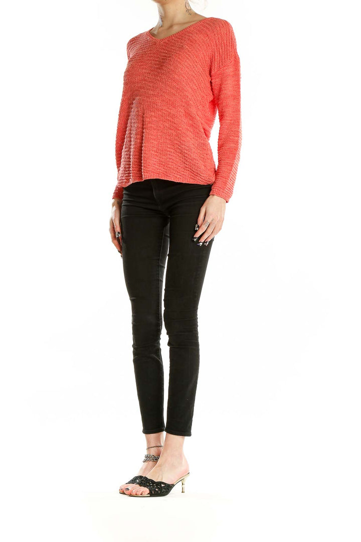 Front view of coral textured V-neck sweater by Calvin Klein Jeans