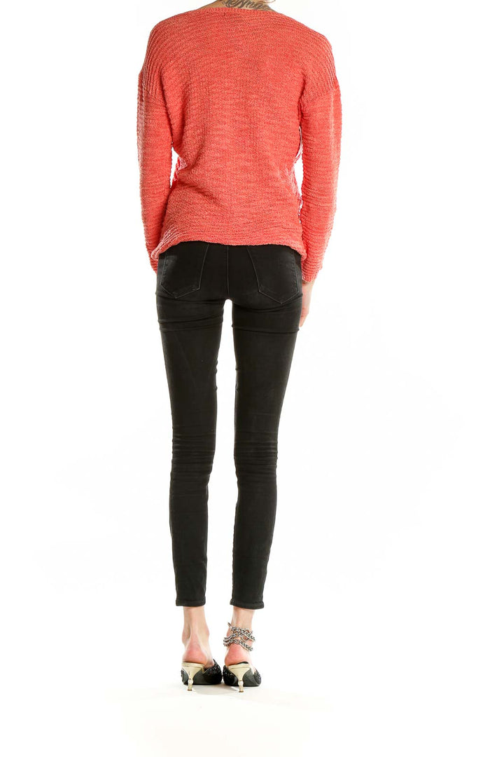 Back view of coral textured V-neck sweater by Calvin Klein Jeans