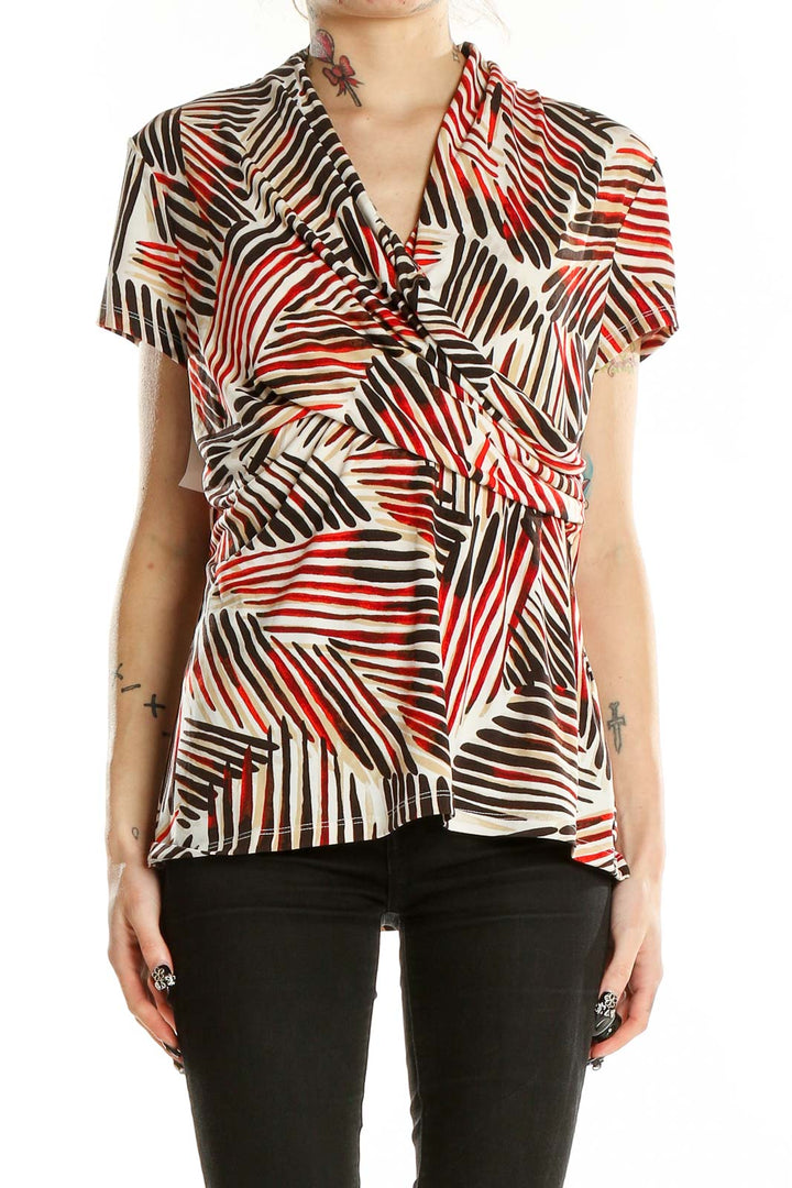 Front view of DKNY red and brown geometric print blouse with v-neck