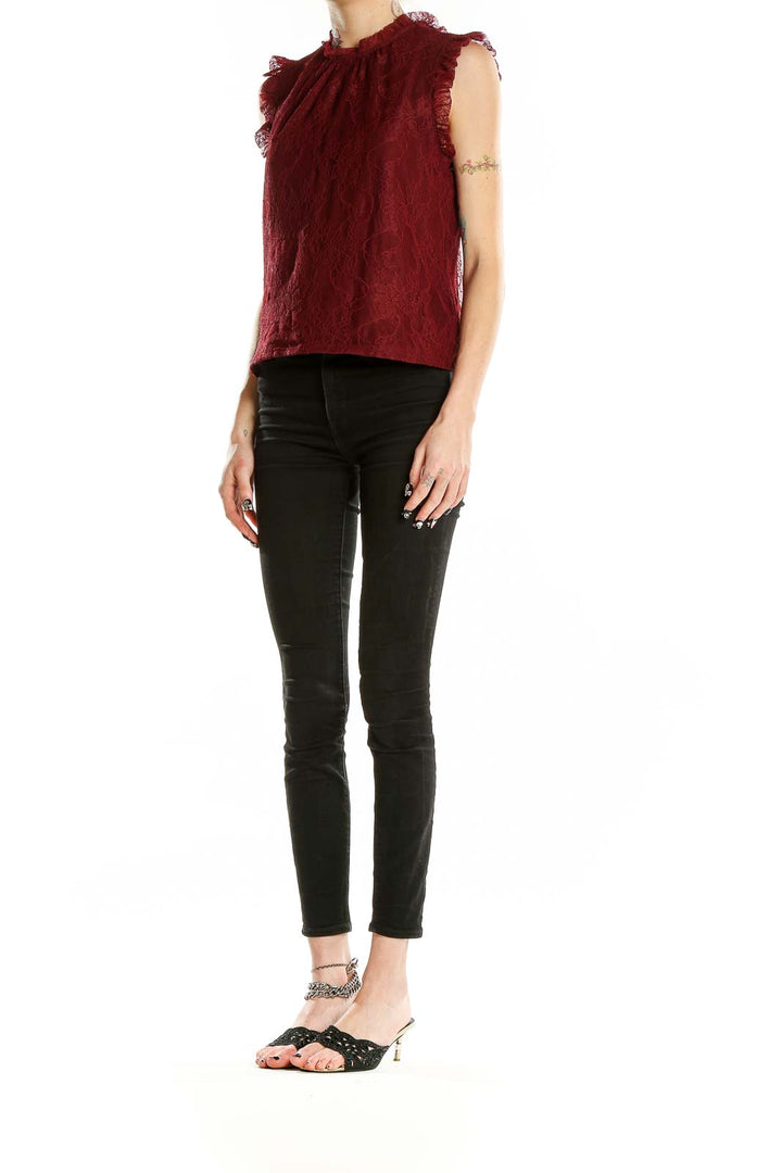 Front view of burgundy lace sleeveless blouse with high ruffled neckline