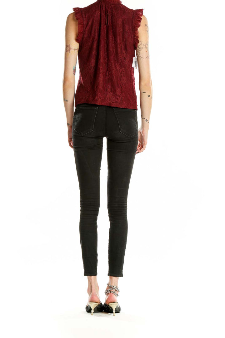 Back view of burgundy lace sleeveless blouse showing all-over lace pattern