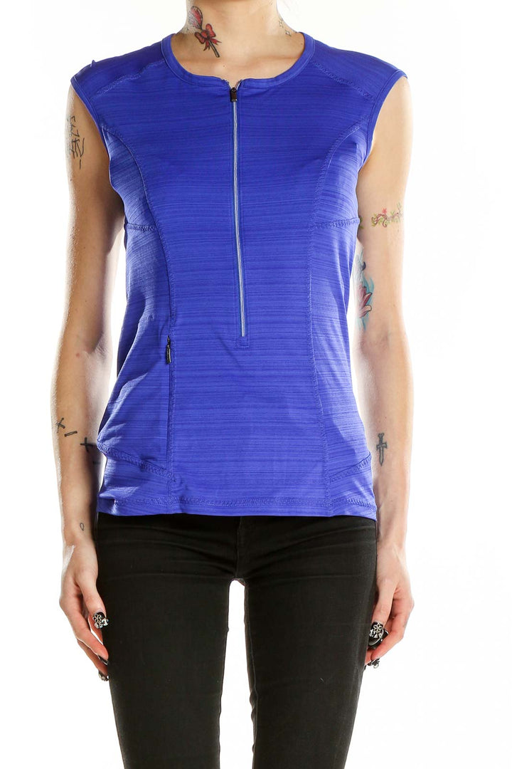 Front view of blue sleeveless Athleta athletic top with half-zip