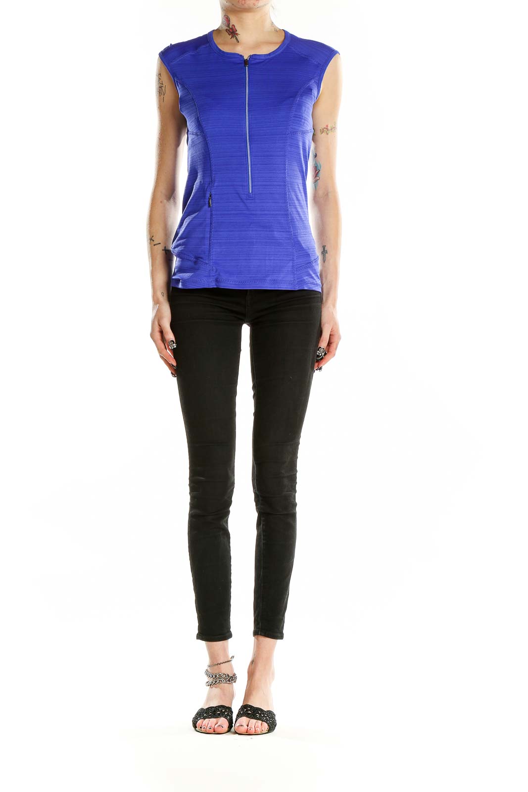 Front view of blue sleeveless Athleta athletic top with half-zip