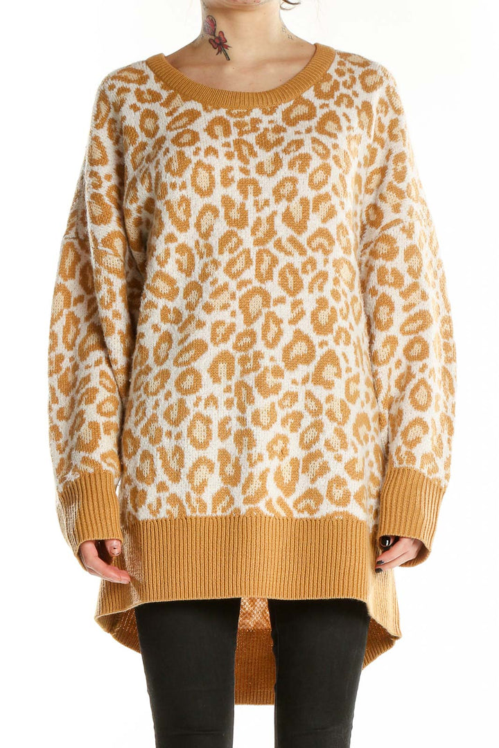 Front view of camel leopard print oversized sweater from Torrid