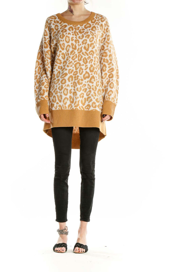 Front view of camel leopard print oversized sweater from Torrid