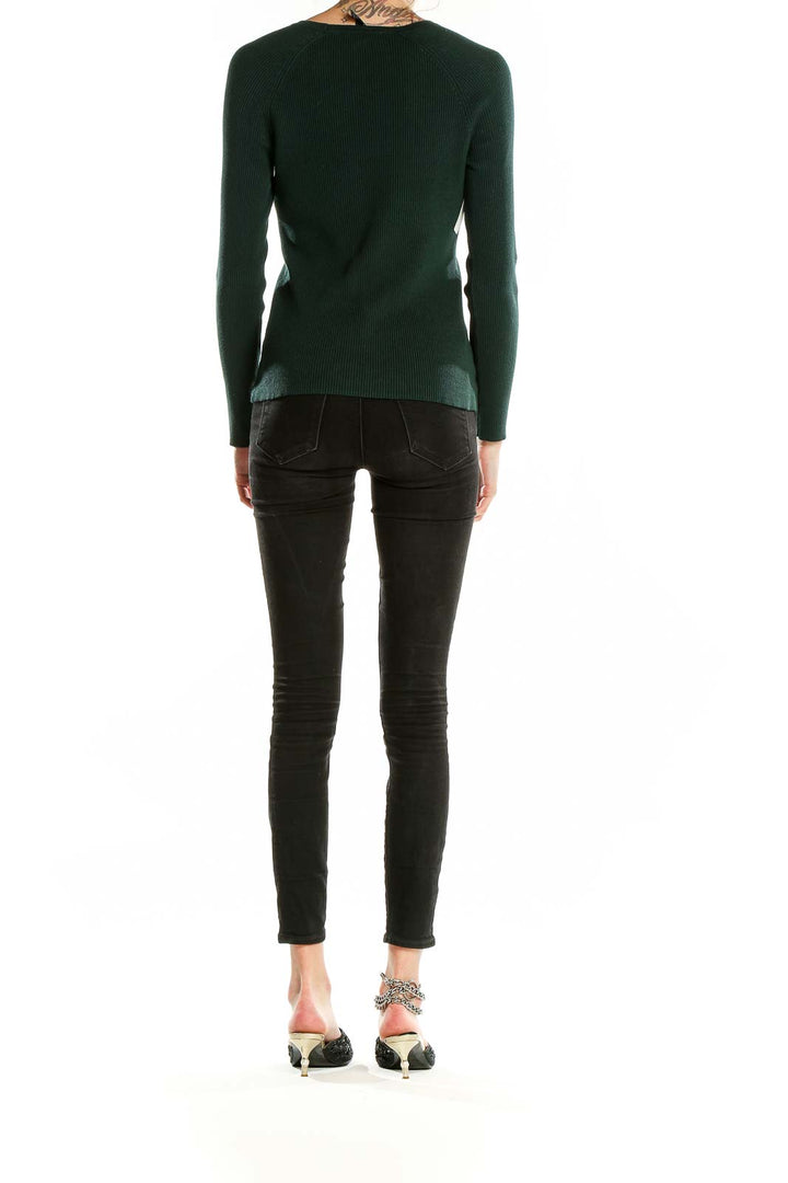 Back view of INC forest green ribbed sweater showing smooth silhouette