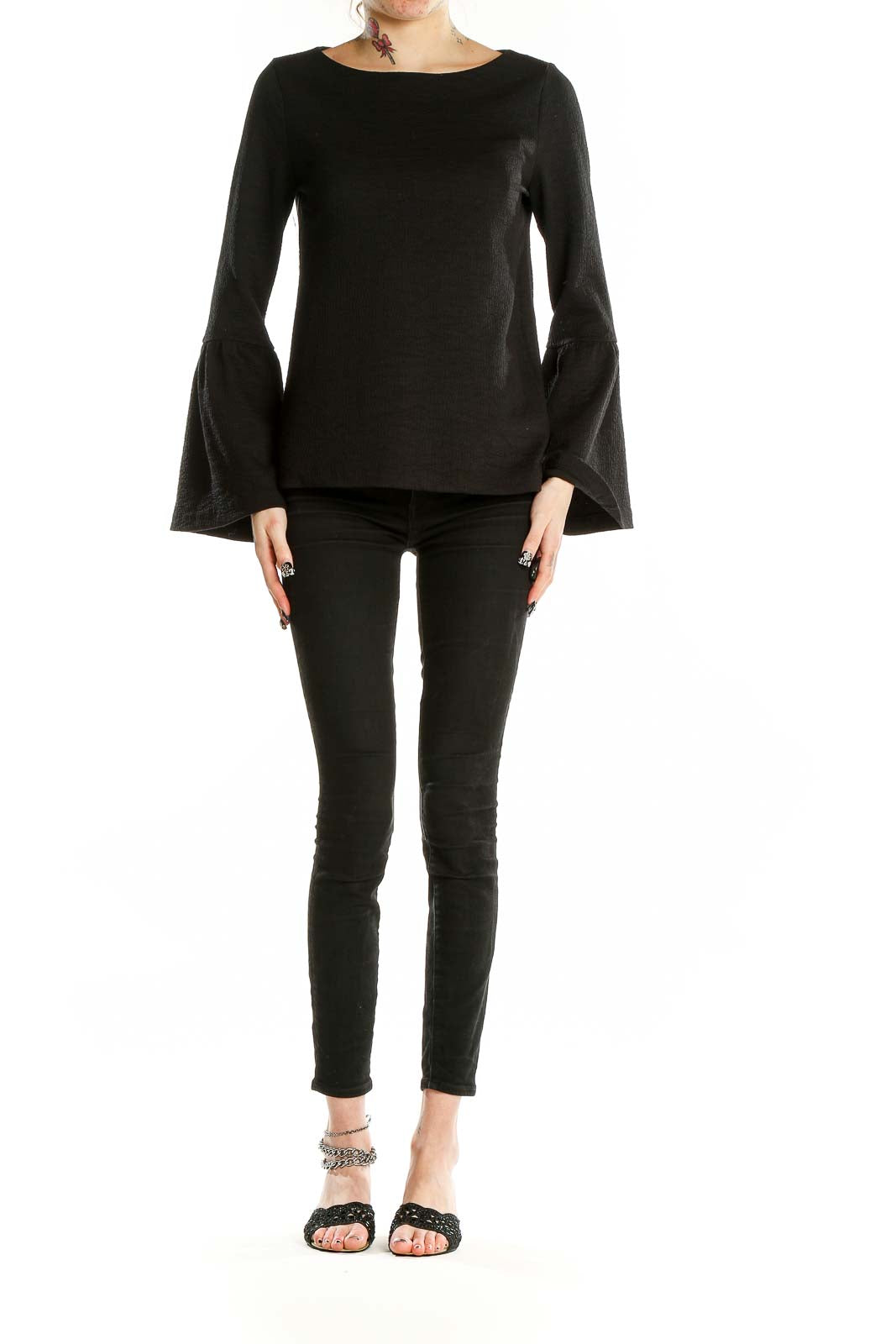 Front view of Ann Taylor black textured top with bell sleeves