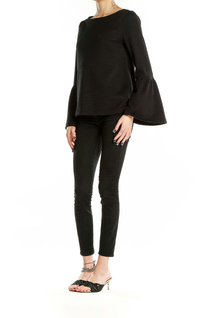 Front view of Ann Taylor black textured top with bell sleeves