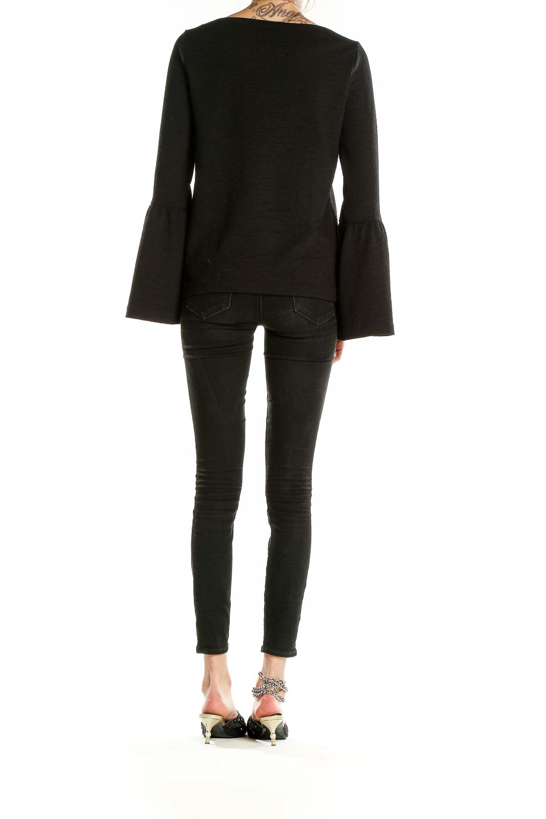 Back view of Ann Taylor black textured top with bell sleeves