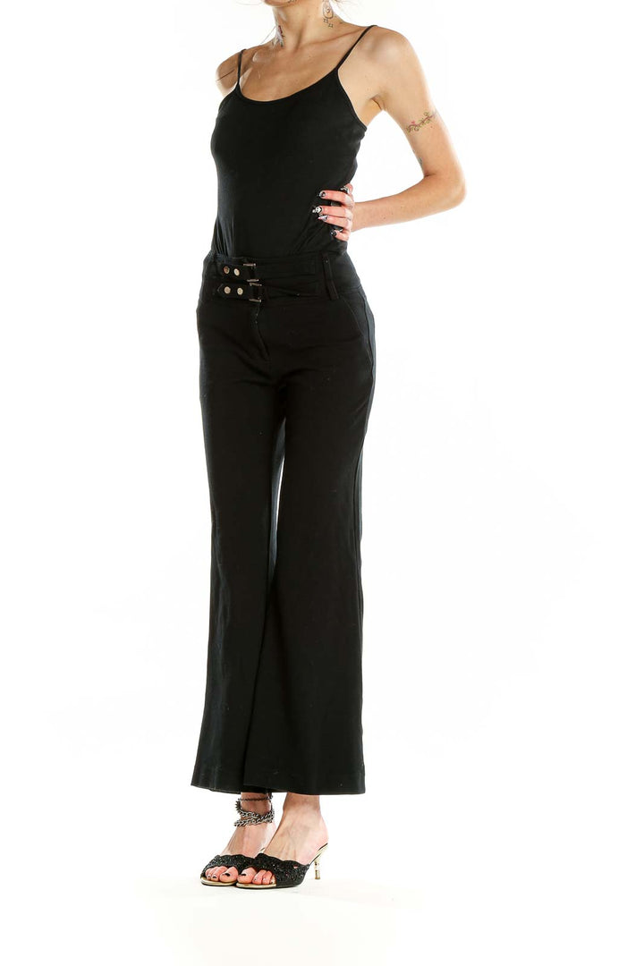 Front view of black high-waisted wide-leg pants with triple-buckle waist detail