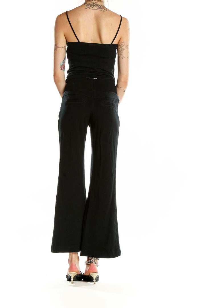 Back view of black high-waisted wide-leg pants showing full length and fit