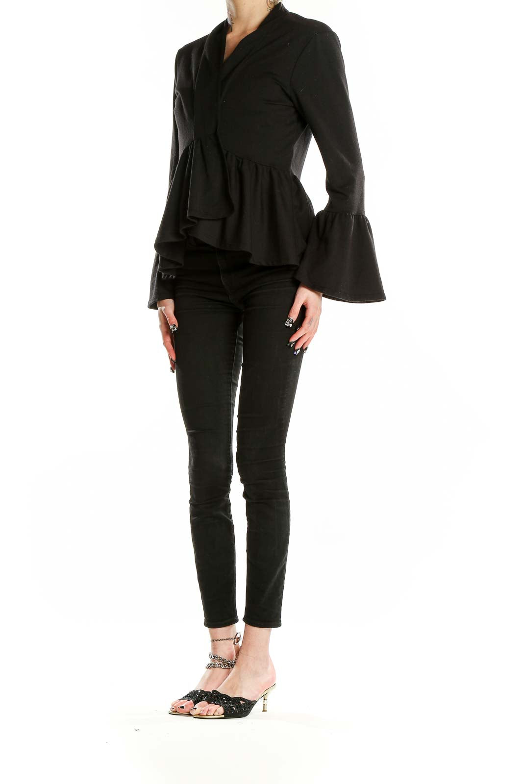 Front view of black peplum top with bell sleeves by Pebble and Stone