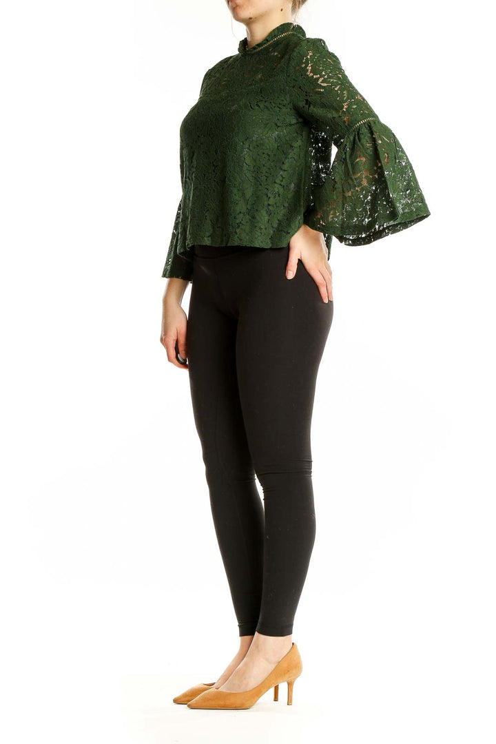 Front view of green lace crop top with bell sleeves by JACK by BB Dakota