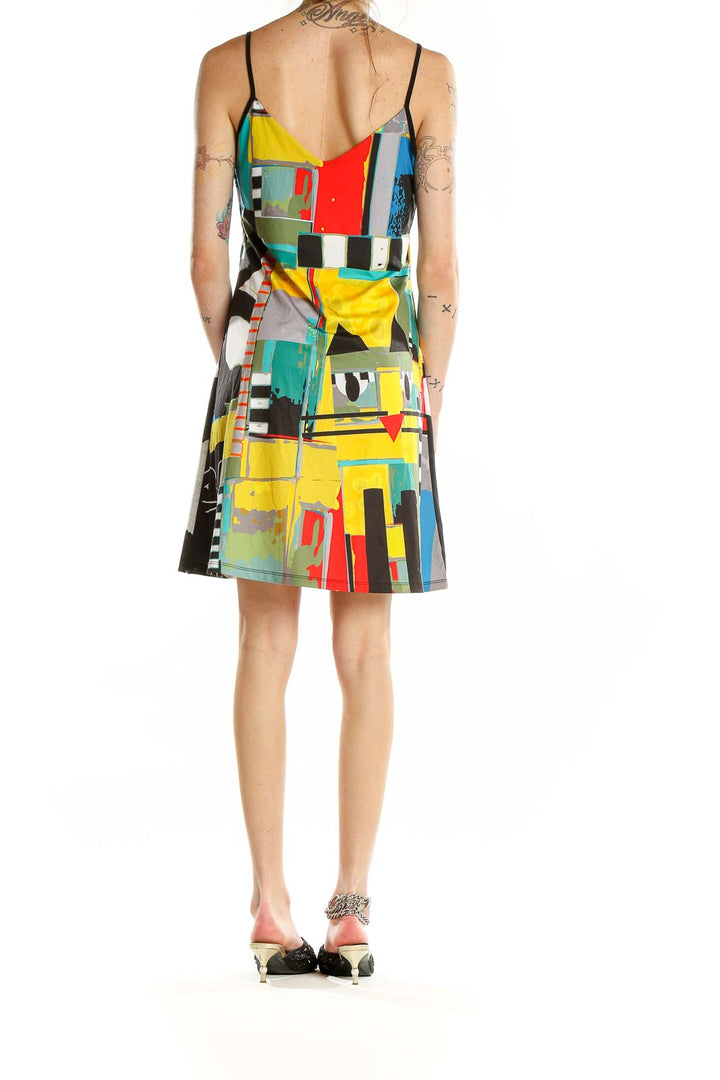 Back view of multicolor abstract print slip dress showing full pattern