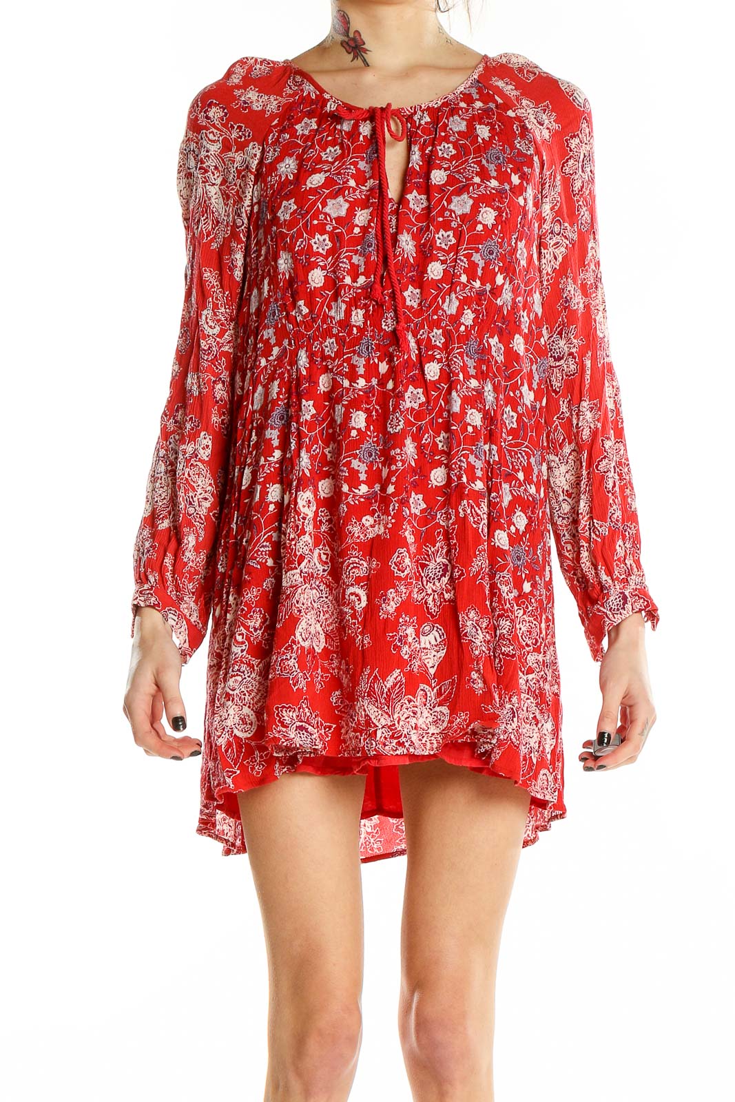 Front view of red floral Free People mini dress with long bell sleeves