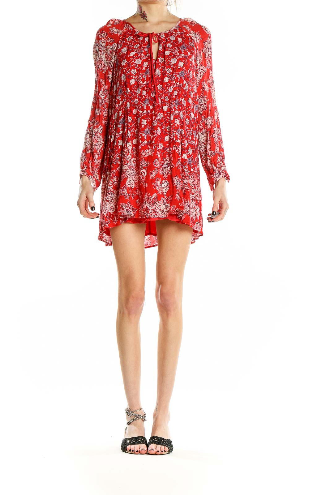 Front view of red floral Free People mini dress with long bell sleeves