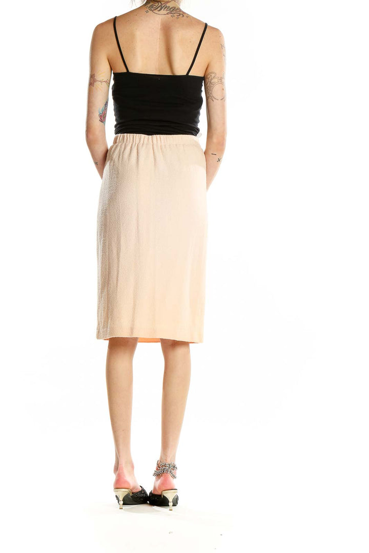 Back view of St. John Evening beige pencil skirt on model