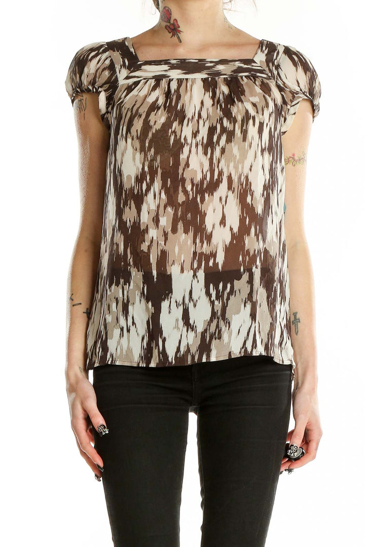 Front view of Ann Taylor brown abstract print blouse with puff sleeves