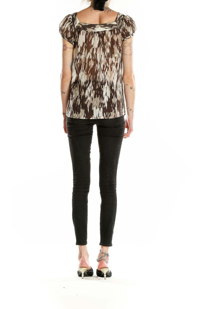 Back view of Ann Taylor brown abstract print blouse showing relaxed fit