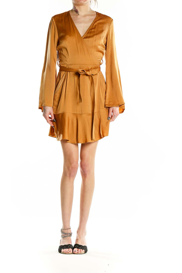 Front view of A.L.C. golden satin wrap mini dress with V-neckline and tie belt