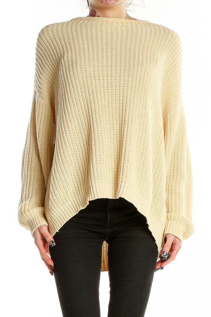 Front view of Margaux Lonnberg cream oversized ribbed cotton sweater