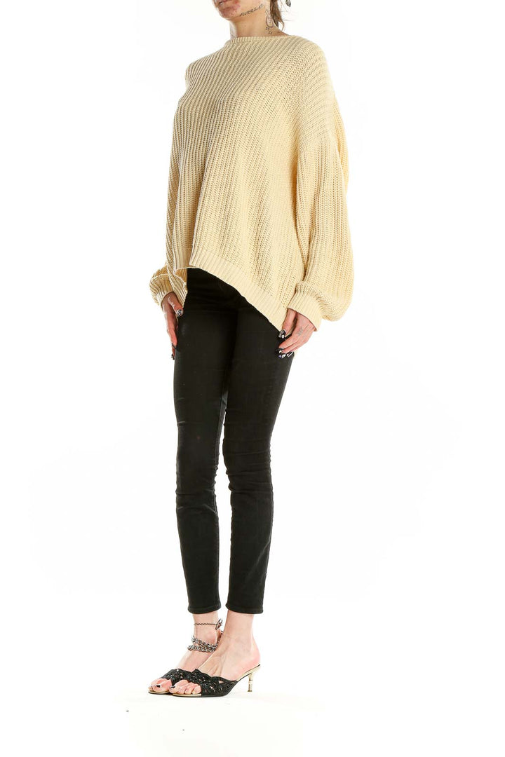 Front view of Margaux Lonnberg cream oversized ribbed cotton sweater