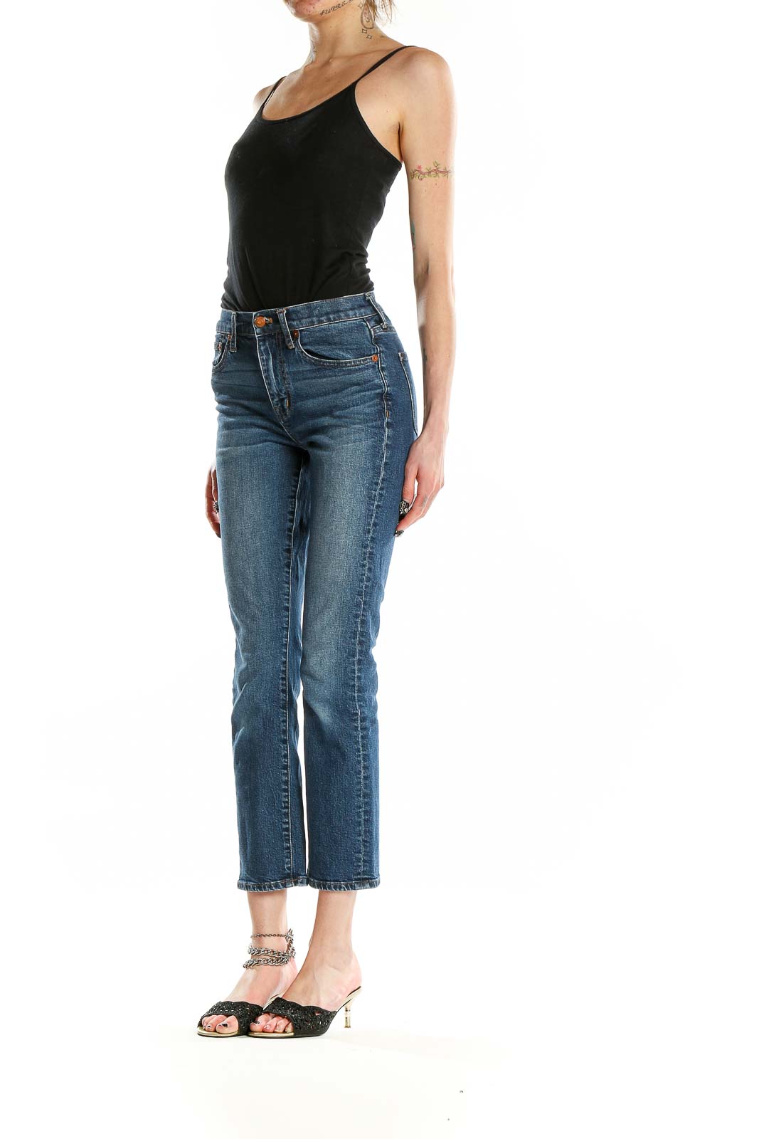 Front view of Madewell blue cropped straight-leg jeans on model