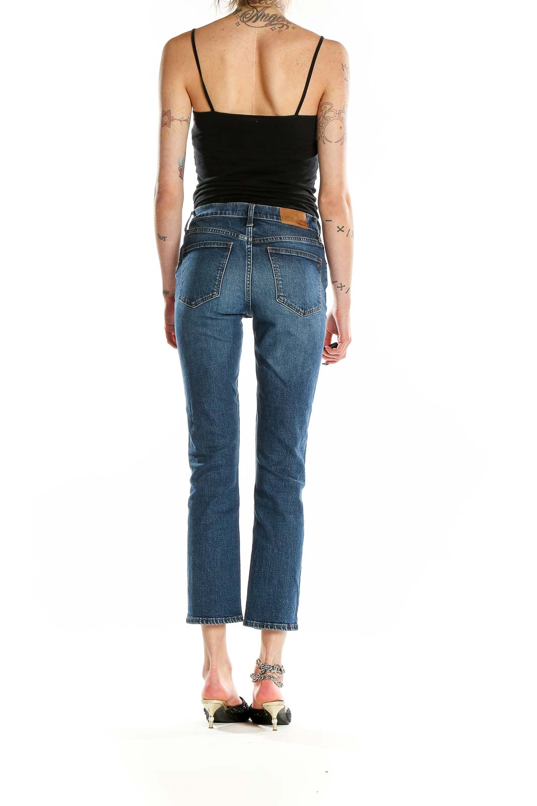 Back view of Madewell blue cropped straight-leg jeans on model