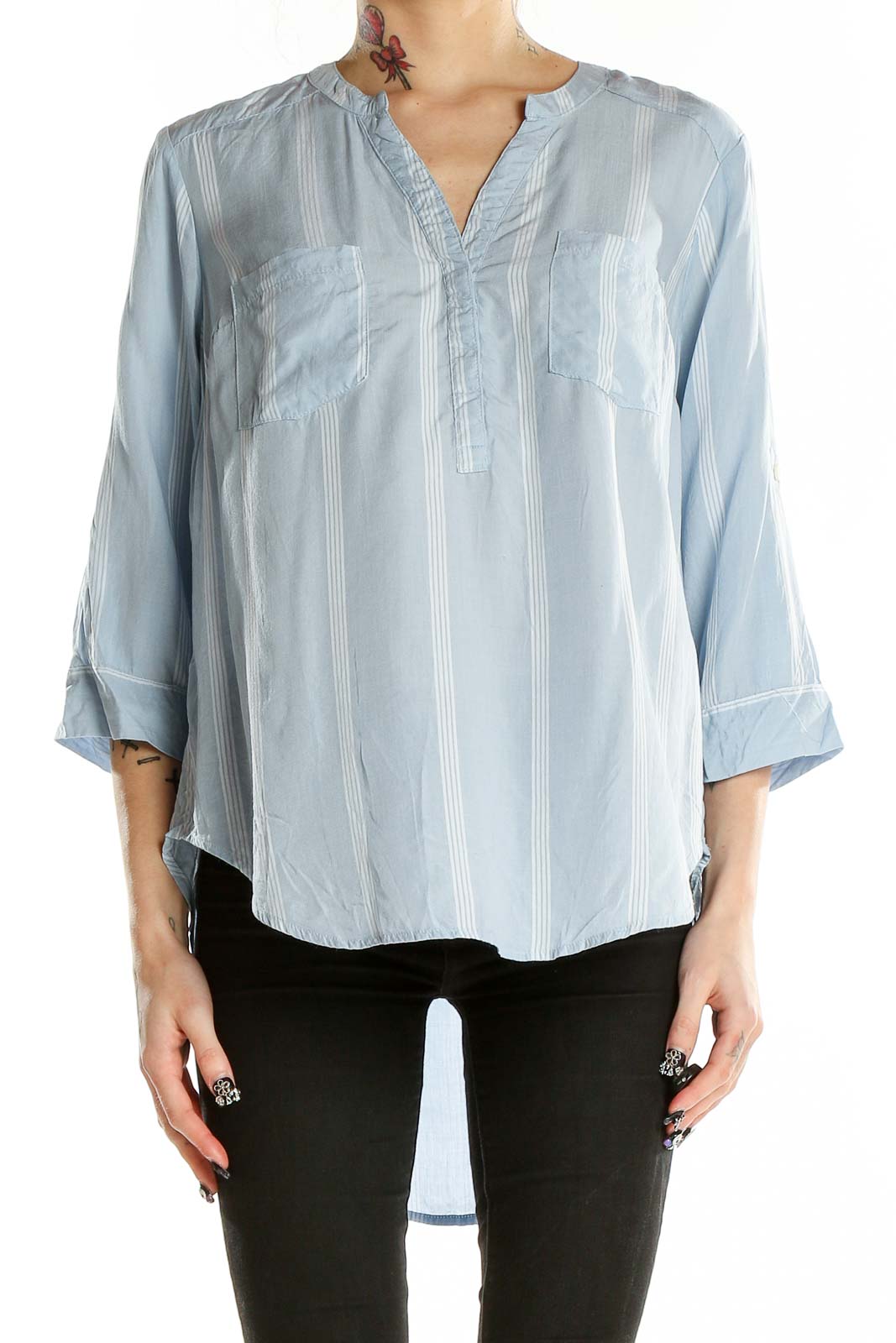 Front view of light blue striped modal blouse from Torrid with v-neck and patch pockets