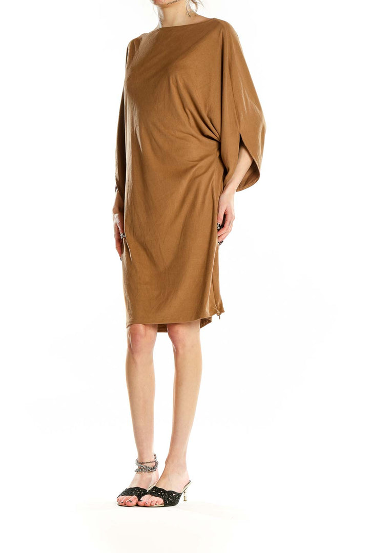 Front view of camel-colored midi dress with batwing sleeves and boat neckline