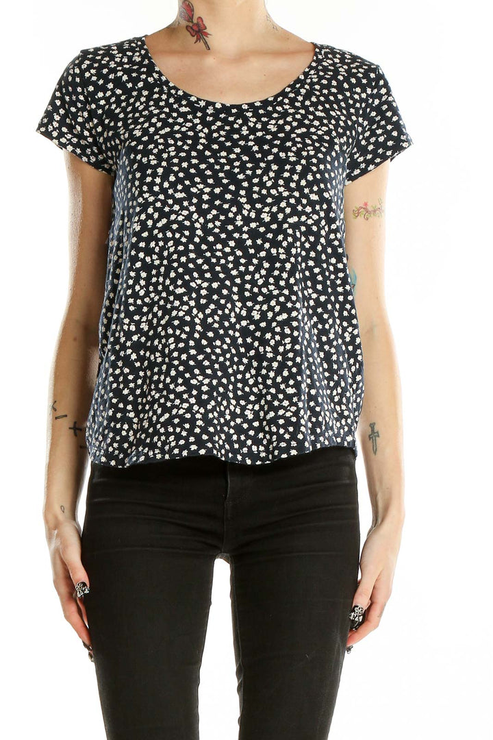 Front view of Gap black short sleeve top with white floral print