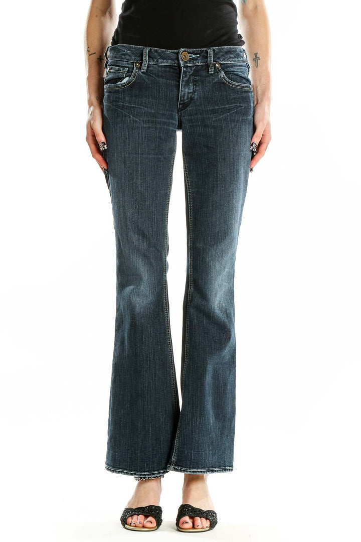 Front view of Silver Jeans Co. blue flared jeans on model