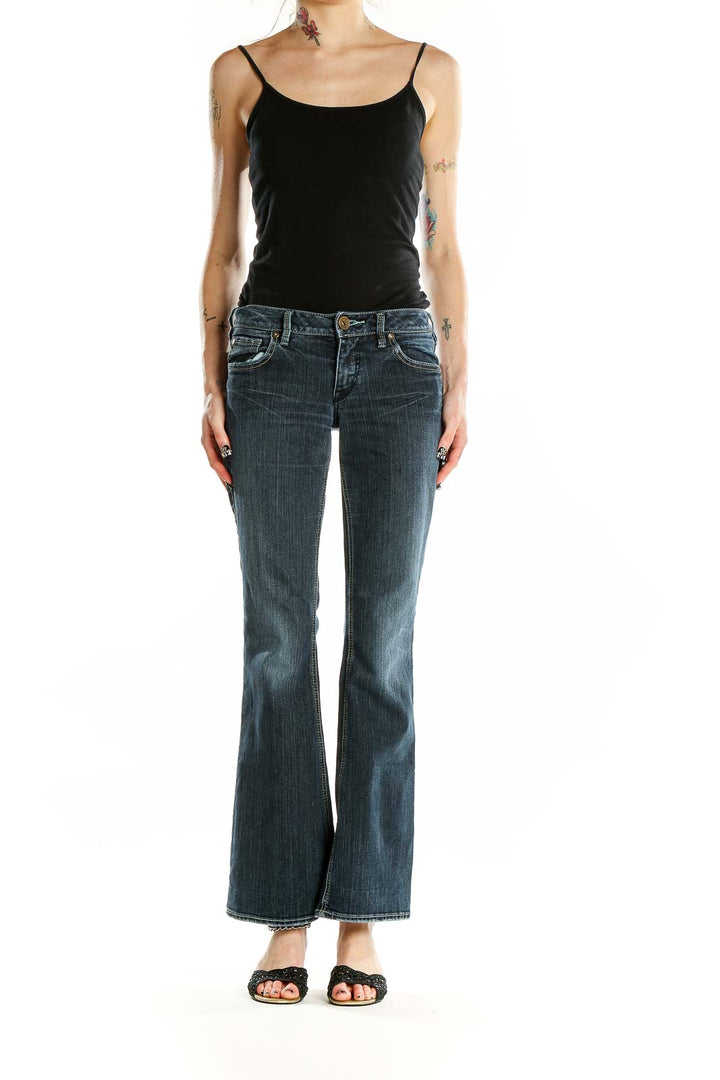 Front view of Silver Jeans Co. blue flared jeans on model