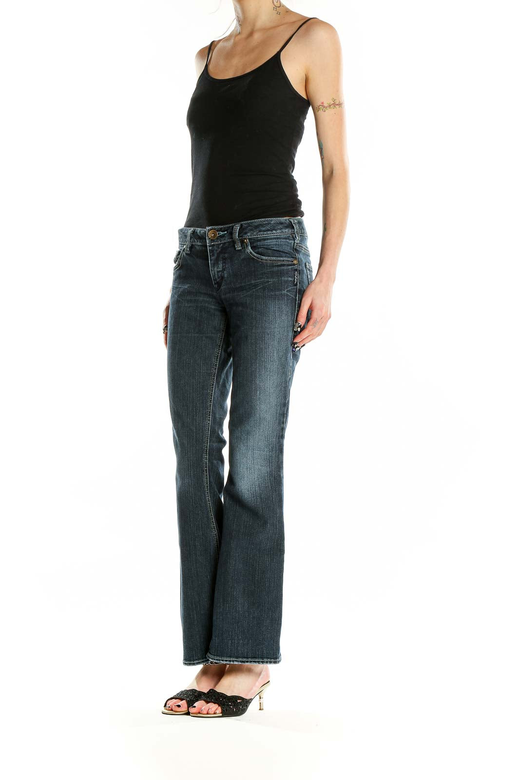 Front view of Silver Jeans Co. blue flared jeans on model