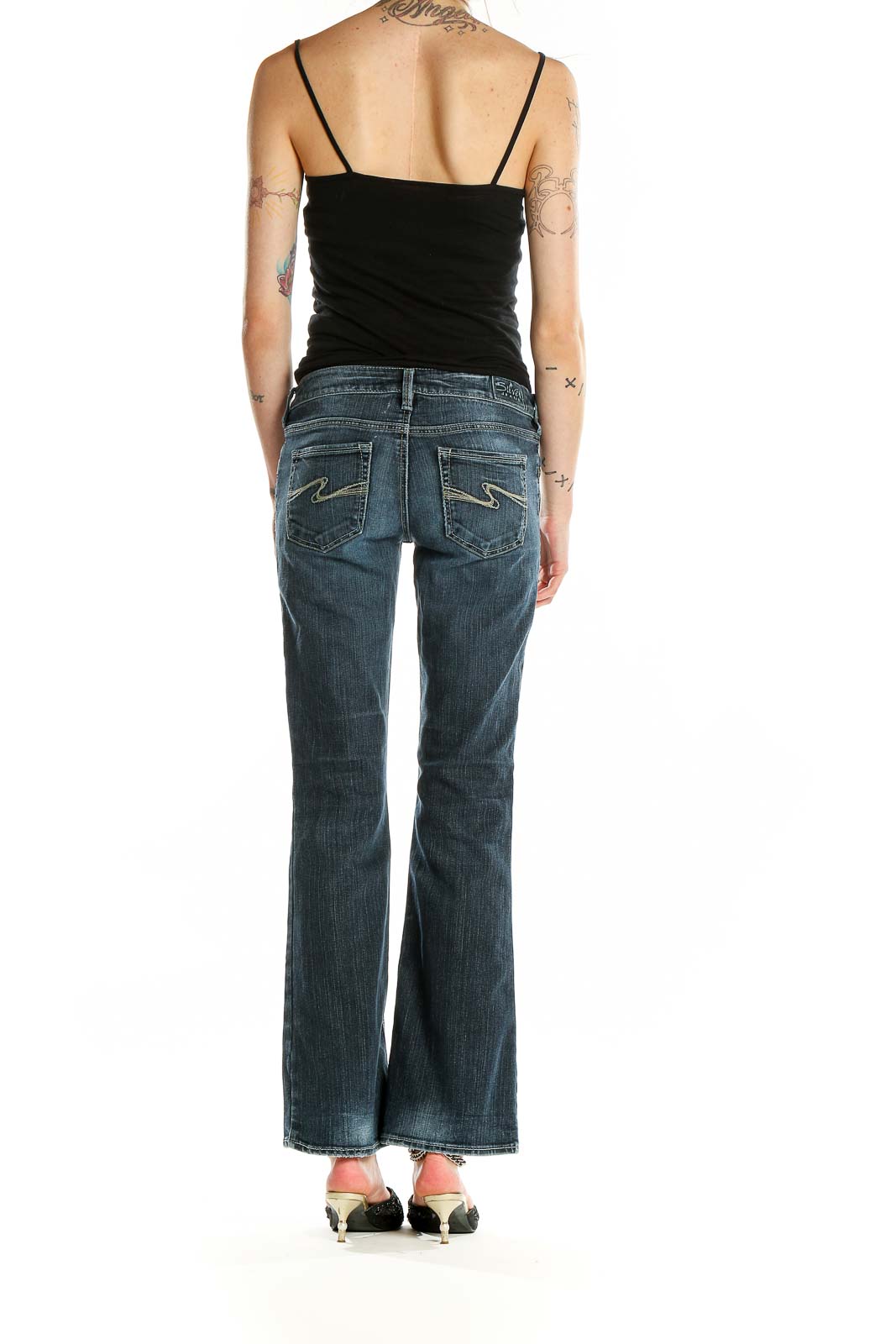 Back view of Silver Jeans Co. blue flared jeans showing signature pocket stitching