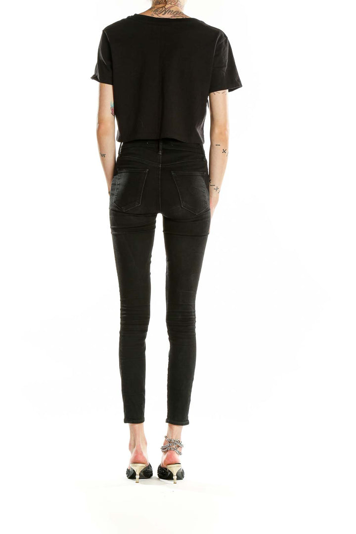 Back view of black cropped cotton t-shirt from Urban Outfitters