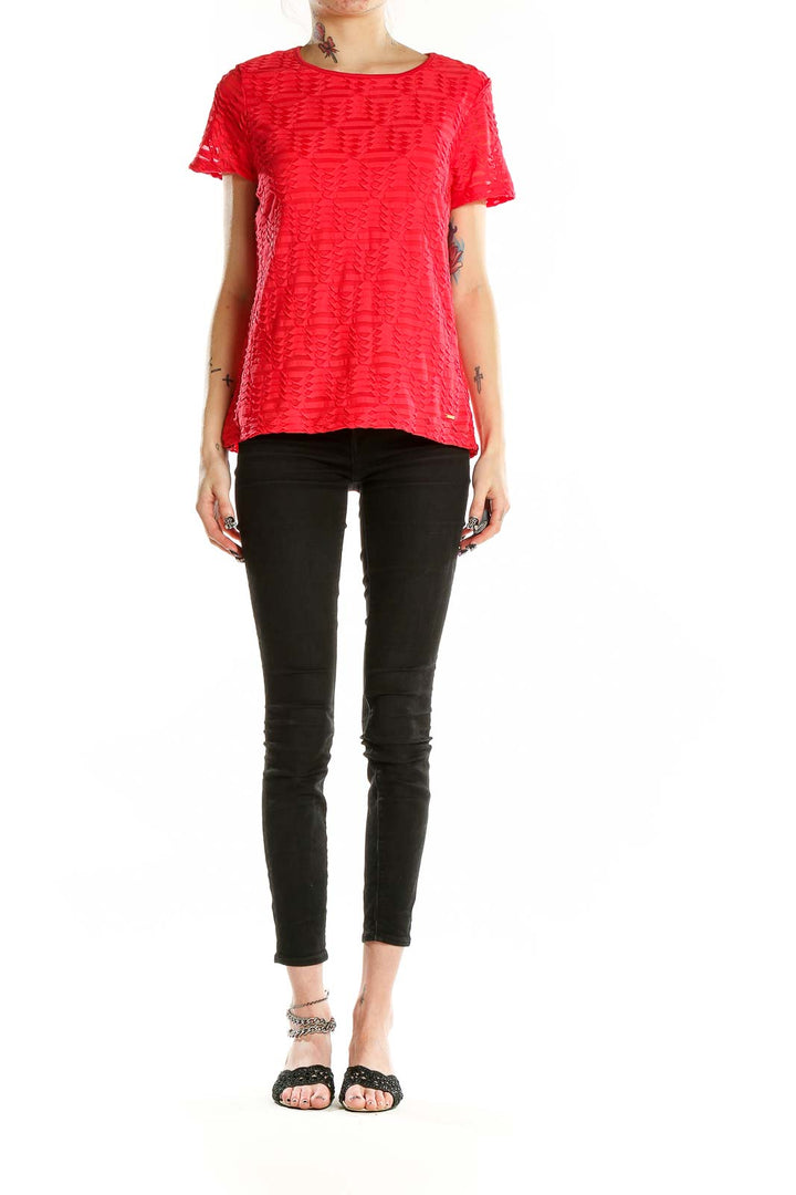 Front view of red textured short sleeve top by Calvin Klein